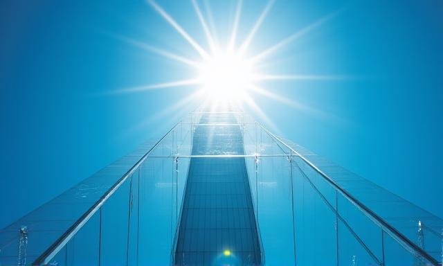 Skyscraper pointing into a clear sky under high-pressure conditions